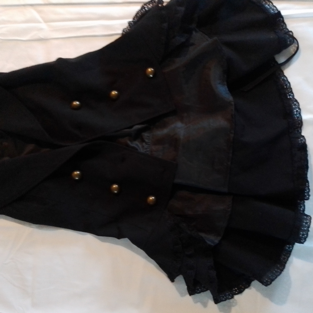 Gothic looking black dressy top with bronze button